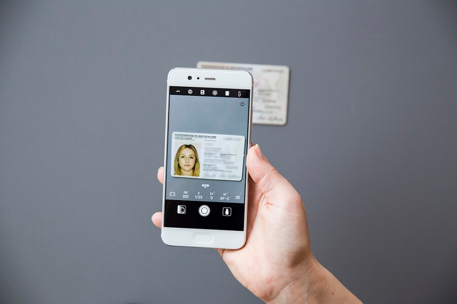 Self-service SIM card activation service with biometrics